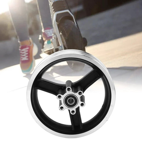 10 Inch Electric Scooter Front Wheel Hub Replacement Part Made From Lightweight Aluminum Alloy shown with scooter in background