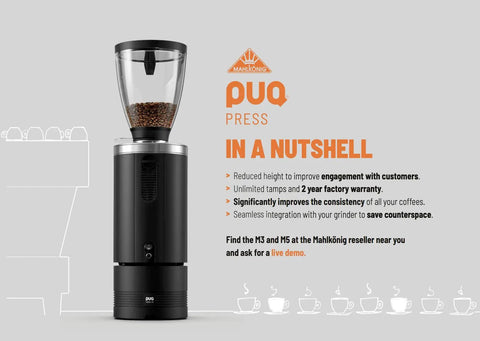 Badass Automatic Espresso Tamper Delivers Killer Precision Brewing Control, Adjustable Pressure Profiles And Slick Calibrated Grip, Smooth Press Action Fits Mahlkonig E80 Grinders, Top Shelf Black Barista Setup 54.3 Mills - display of puq press with coffee beans.