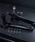 44T 130 Crankset With Bottom Bracket For Road Bikers, Lightweight Hollow Design, Anodized Finish, 170mm Length, Bike Conversion Upgrade For Smoother Speeds And Snappier Pedals. black aluminum bike crankset with bottom bracket and bolts