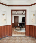 Mid Century Modern Globe Wall Sconce Set Of Two In Brushed Brass Gold With Clear Glass Ball Lamps in elegant hallway.