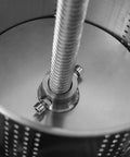 Inside view of Heavy Duty T Handle Fruit Wine Press With Dual Stainless Steel Barrels, showing stainless steel drum and screw mechanism.