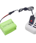 Two Pack AA 7.2V 2800mAh NiMH RC Battery Pack With SM2P Plug And USB Charging Cable connected to a charger