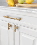 Champagne Bronze Cabinet Pulls Set 5 Inch 128mm Hole Center 10 Pack installed on white kitchen cabinets