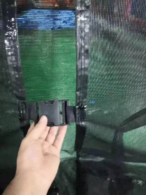 Hand holding buckle on 20x16ft Commercial PVC Inflatable Batting Cage For Baseball Practice With Net, Durable Black Outdoor Sports Gear