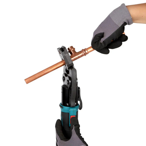 Using Copper Press Rings Kit For Pipes From Half Inch To Two Inches on copper pipe with tool in hand for tight spots and angles