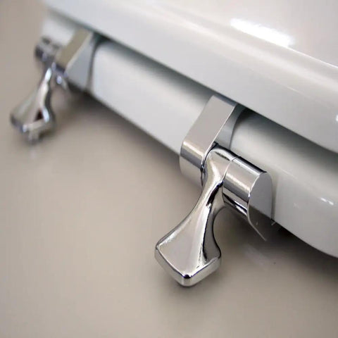 Close-up of Beadboard Round Toilet Seat With Chrome Hinges In White Enamel Wood Durable One Pack Sta-Tite Fastening System