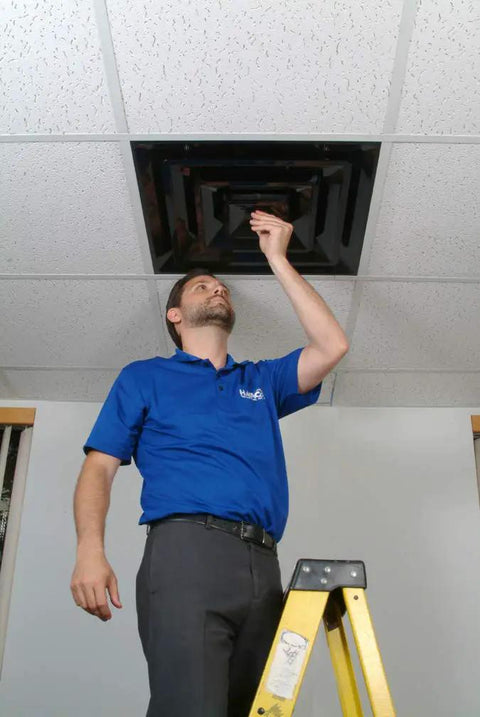Person installing Lay In 2x2 Ceiling Diffuser With 3 Cone Supply And 8 Inch Pre Molded Boot In ABS Plastic Black for ventilation