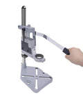Rock Solid Drill Press Stand For Hand And Power Drills With Tight Grip Benchtop Mount Adapter showing a person operating the lever.