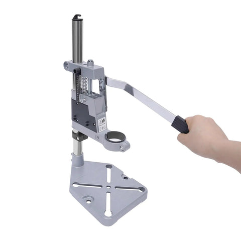 Rock Solid Drill Press Stand For Hand And Power Drills With Tight Grip Benchtop Mount Adapter showing a person operating the lever.