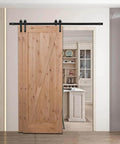 Heavy Duty Sliding Barn Door Hardware Kit For Double Door Bypass And Single Track Low Ceiling Mount 5Ft Rail Tough As Nails Carbon Steel With Black Frost Finish Supports Up To 200 Lb Easy Install showing a wooden barn door installed in a living space.