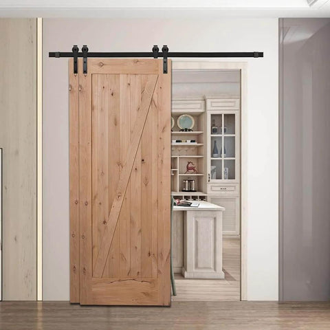 Heavy Duty Sliding Barn Door Hardware Kit For Double Door Bypass And Single Track Low Ceiling Mount 5Ft Rail Tough As Nails Carbon Steel With Black Frost Finish Supports Up To 200 Lb Easy Install showing a wooden barn door installed in a living space.