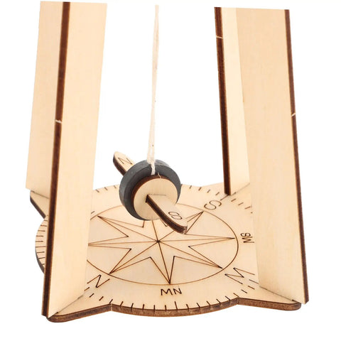 Close-up of floating compass in Stem Building Kit For 3D Compass Project Educational Science DIY Wood Craft Kit For Kids And Teens