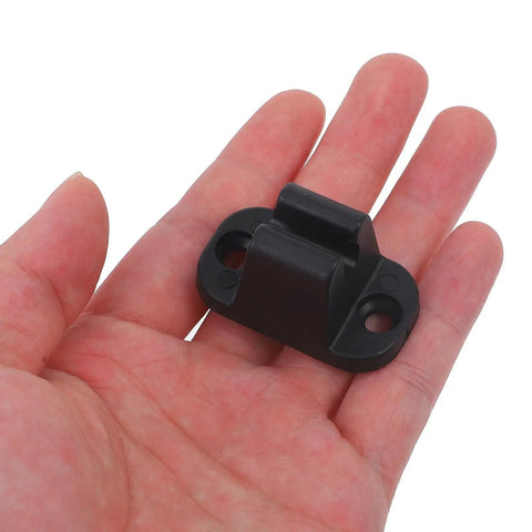 Tough Black Nylon Rv Door Catch Retainer Hook Replacement For Your Motorhome Or Camper that fits in a hand.