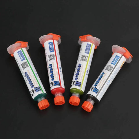 Four tubes of colored paste for Flux Repair Kit With Light Curing Liquid No Clean Flux For PCB BGA Boards Includes Precision Needles And Flashlight.