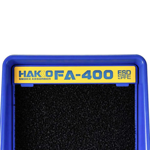 Close-up of Pro Solder Smoke Absorber with activated carbon filter in blue plastic frame, branded as Hakko FA-400.