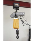 Electric Hoist For One Ton Load, Nine Point Eight Feet Lift, 110V Power, Remote Control With Emergency Stop mounted on beam