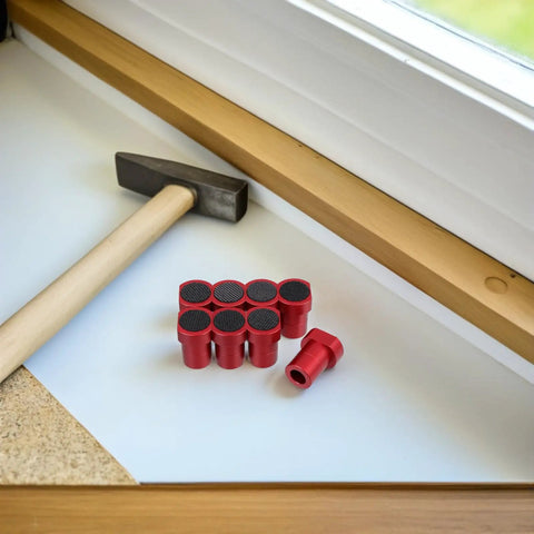 Eight Pack Planing Plugs For Woodworking With Nonslip Surface next to hammer on workbench
