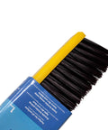 Close-up of Real Deal Heavy Duty Multi Surface Push Broom Featuring Stain Resistant Coarse Polypropylene Bristles and Solid Plastic Block Head.