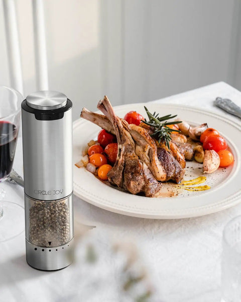 Electric Pepper Grinder Stainless Steel Rechargeable With External Coarseness Dial 95ml Capacity Silver Finish on dining table