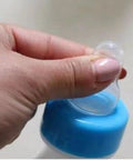 Close-up of hand holding Heavy Duty Lamb Feeding Bottle With Super Soft Nipple For Chill Weaning showing soft nipple.