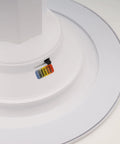 Close-up of Slick LED Recessed Retrofit Light with adjustable CCT levels for crisp ceiling glow, showcasing light color tags.