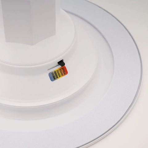 Close-up of Slick LED Recessed Retrofit Light with adjustable CCT levels for crisp ceiling glow, showcasing light color tags.