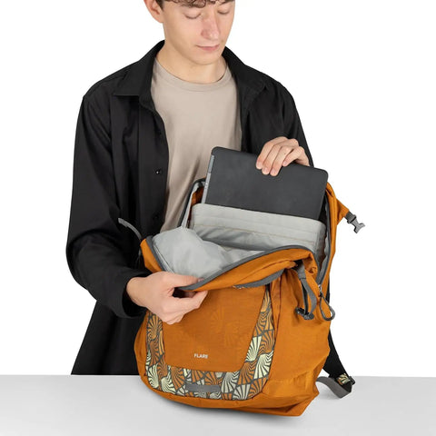 Person placing a laptop into Urban Commuter Laptop Backpack With 16 Inch Laptop Sleeve AirScape Backpanel Front Organizer Stretch Pocket And Blinky Light Attachment For Campus And City Commutes