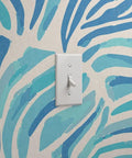 Modern Animal Print Vinyl Wallpaper Delivers Slick Leather Texture And Tough As Nails Durability For Busy Commercial Spaces And Gets Custom Printed For Your Walls with blue zebra stripes and light switch.