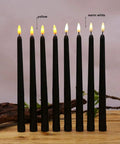 Pack Of 12 Flameless Taper Candles 11 Inch Flickering Warm White LED Candles Battery Powered Realistic Plastic Candles For Christmas Decor Easy On Off Switch Safe Cozy Glow For Tables And Mantels displayed on a wooden surface