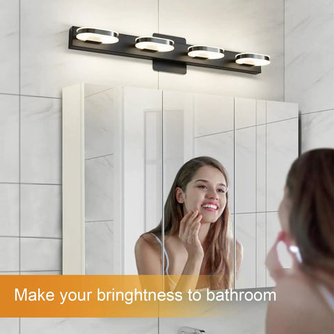 Woman using mirror under Modern LED Vanity Light 3-Head Wall Sconce For Bathroom, 19 Inch Black Finish, lit natural white light.
