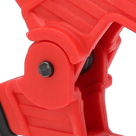 Close-up of red jaw of Beefy Heavy Duty Woodworking Spring Clamp With Anti Slip Handle And 4 Inch Opening Two Color Durable ABS Plastic