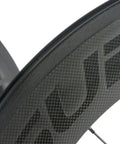 Close-up of 88mm Carbon Fiber Wheelset For 700C Clincher, 23mm Inner Width, 3K Matte Rim, showing the carbon weave texture.