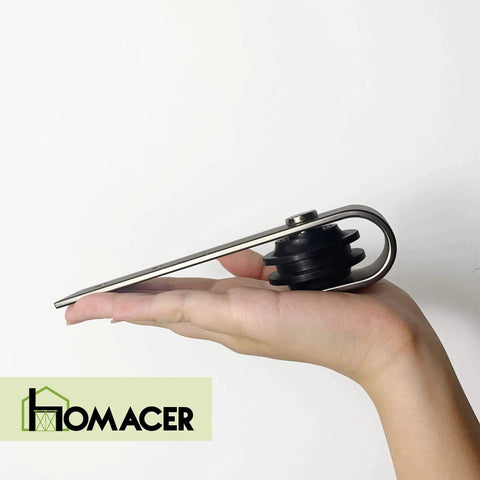Side view of a Mini Brushed Nickel Non Bypass Sliding Barn Door Hardware Kit roller showcasing design on a hand.