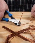 Person using Heavy Duty 8 Inch Diagonal Cutting Pliers With High Leverage Design Made In USA Workhorse Tool to cut copper wire.