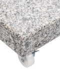 Close-up of corner granite and stainless steel tube parasol base with wheels for easy mobility and quick positioning, weather resistant.