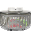 Killer Electric Salad Spinner With Six Liter Capacity And Rapid Spin Motor Plus Splash Guard Drain Basket For Super Chill Kitchen Vibes And Crisp Veggie Prep Daily with wet greens inside.