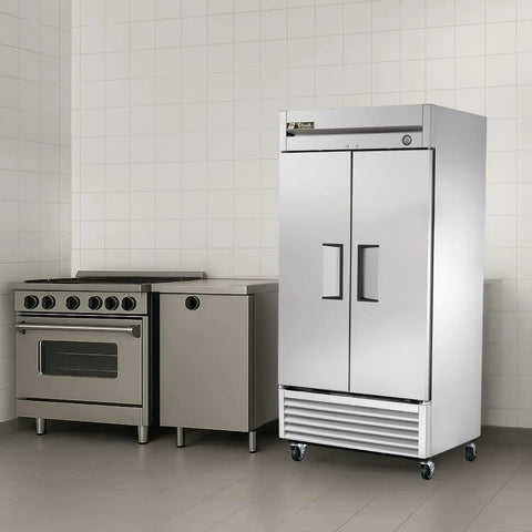 No Nonsense 40 Inch Reach In Freezer With 35 Cubic Feet Upright Cold Storage Tough Stainless Steel Cabinet Two Self Sealing Swing Doors 115V Plug And Play Kitchen Workhorse Rig in a commercial kitchen.