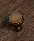Round Knobs 1 Inch Solid Zinc Alloy Antique Brass Cabinet Handles, 4 Pack, Vintage Kitchen Bath Drawer Pulls on wood surface