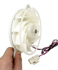 Person holding a DC 12V Refrigerator Evaporator Fan Motor Replacement Part For Freezer And Fresh Food Cooling Quiet DIY Friendly 1870 RPM 2.5W 0.12A Durable OEM Style Replaces DA96-00968A DA31-00334A PS9494284 AP5948644 showing blades and wires