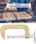 Hefty 6 Inch C Clamp For Woodworking And Welding Made From Heavy Duty Heat Treated Carbon Steel in a workshop setting.