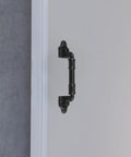 Close-up of a black barn door pull handle made from sturdy iron alloy, no-drill on a modern sliding door.