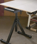Heavy-duty 3-row ball bearing roller stand supporting table saw, adjustable 28-44 inches, perfect for long rips and crosscuts
