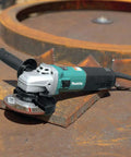 5-Inch SJS High Power Angle Grinder With 13 Amp Motor, shown on metal surface, partial view