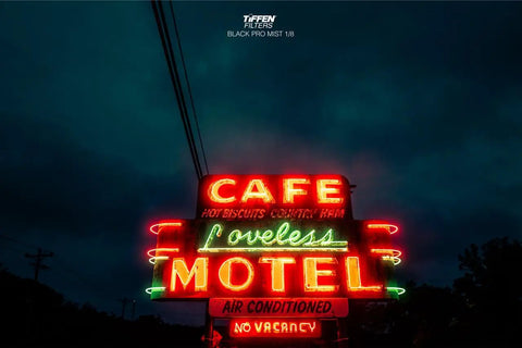Neon motel sign captured with 49mm Black Pro Mist One Eighth Diffusion Filter Ultra Slim for Cinematic Portraits Video and Vlog Soft Glow Highlights