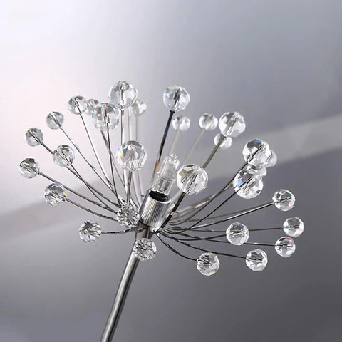Close-up of Crystal Glass 3 Light Dandelion Wall Sconce in brushed nickel, stainless steel with crystal details, modern starburst design