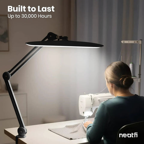 Mega Bright 2200 Lumens LED Desk Lamp With 24W Power Shadow Free Task Lighting illuminating a sewing workstation in black.