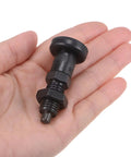 Heavy Duty Carbon Steel M12 Spring Plunger with ball nose tip and nuts, held in hand for secure clamping tasks.