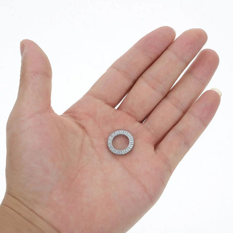 Get Your Garage Ready With These Beefy M10 Manganese Steel Wedge Locking Washers 30 Pairs Set Gripz in a hand showing one washer.