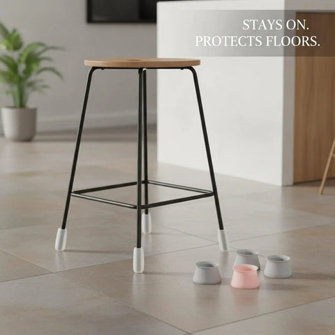 Oval Silicone Chair Leg Caps For Irregular Furniture Legs on black stool on tile floor with extra caps visible