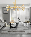 Modern Sputnik Chandelier 12 Light Gold Metal Ceiling Fixture for Living Room Bedroom Dining Kitchen and Office Dope Statement Lighting with E26 Base LED Compatible Bulbs Not Included 38.6 Inch Diameter in stylish living room setting